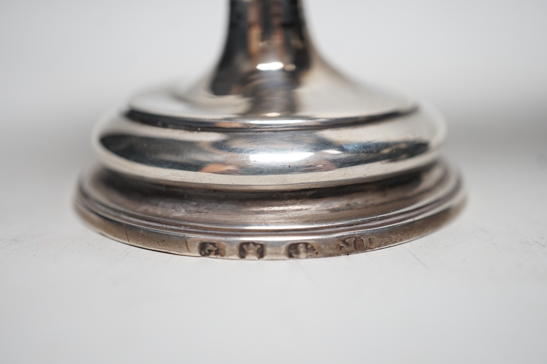 Two late 18th century white metal mounted pedestal coconut cups, one hallmarked silver for John Robbins?, London, 1764, 14.4cm, the other with white metal mounted top rim, on turned wooden base.